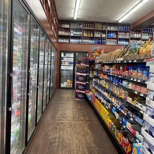 a wide aisle of bottles of beer