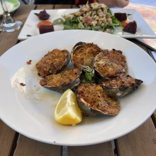 a plate of grilled oysters