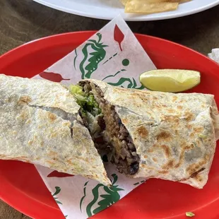 Burrito with suadero, rice, beans, lettuce and avocado. Large portion, so delicious!