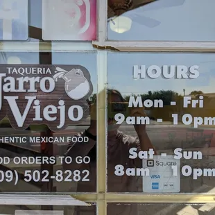 a reflection of a man in the window