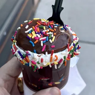 a chocolate cup with sprinkles