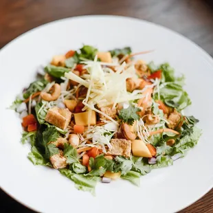 New salad alert! Miso ginger dressing, fresh greens, mango chunks, shredded carrot, cabbage, cashews, tomato, red onion, cilantro,and ginger