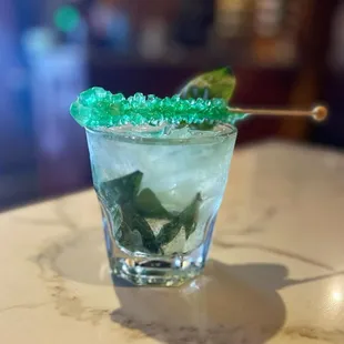 Shamrock Smash
Gin, Thai basil, lime, and simple syrup. Served with a crystal candy.