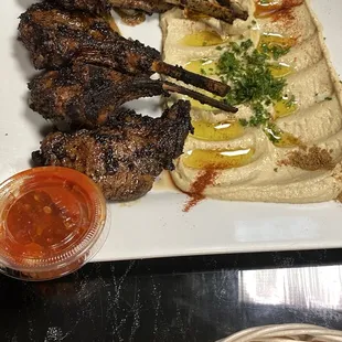 Juicy tender delicious lamb chops with hummus