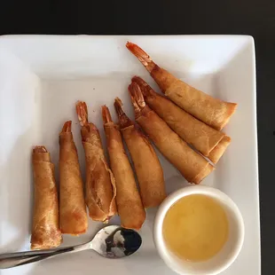 Shrimp in Blanket 
Marinated prawns wrapped in paper crepe, deep fried and served with sweet and sour sauce.