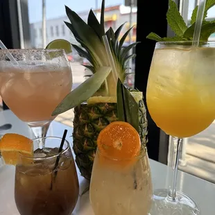 a variety of cocktails on a table