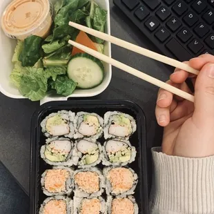 Two Roll Lunch Special. California Roll and Spicy Kani Roll with a Salad. Take Out Order