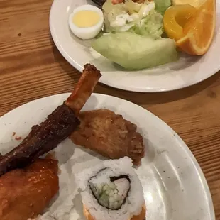 two plates of food on a wooden table