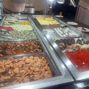 a variety of food items in a buffet