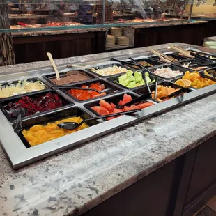 a variety of food in a buffet