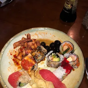 Olives, sushi and squid tentacles.