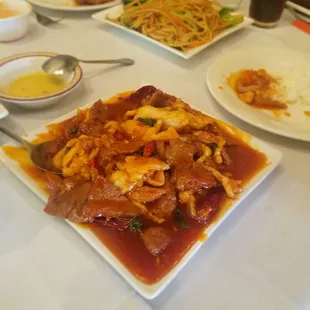 Shanghai meat lovers and lo mein in the background