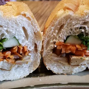 Tofu banh mi, vegan w/o butter ($4). Warm, flaky, perfect bread. Nicely spiced tofu. Best banh mi in the US, no joke.