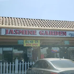 Strip mall front of restaurant.