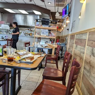 a woman standing in the kitchen