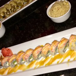 Sunset roll, side of fried rice, and the Kentucky roll in the background.