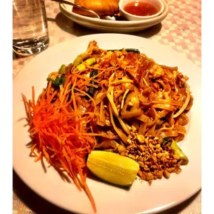 a plate of noodles and vegetables