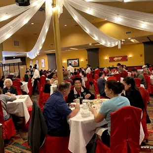 a large group of people sitting at tables