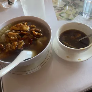 Combination wonton soup and hot and sour soup on right.