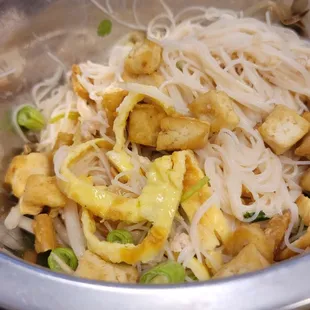 Not on the menu, what the staff was eating. I don&apos;t know what it is but it&apos;s delicious. Noodles, coconut milk, fried tofu and much more.