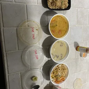 From L to R, garlic chicken fried rice, Tom Yum, Tom Kha, Khao Soi, and chicken fried spring rolls