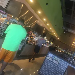 a man standing in front of the counter