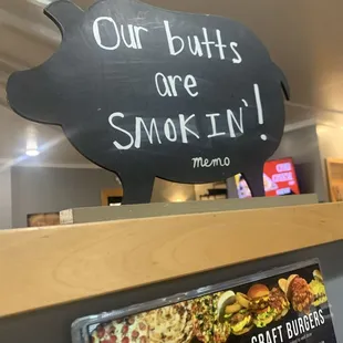 sign that says our butts are smokiin '