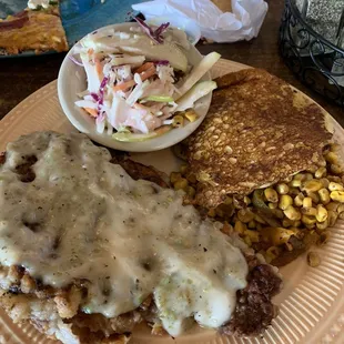 Akaushi Kobe beef steak cutlet, hand battered and covered in jalapeño gravy. Sides are grilled corn, Raspberry apple slaw.