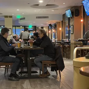 Our original table: regular height chairs and table too high for those chairs. I felt like a toddler. We asked to be moved.