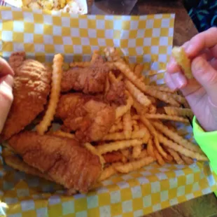 a basket of fried chicken and french fries