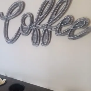 a coffee shop sign on the wall