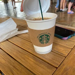 a starbucks cup on a table