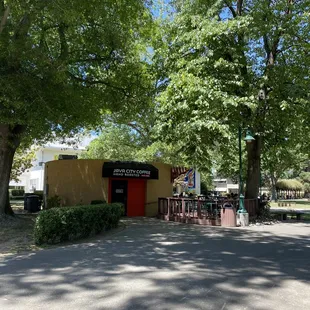 Outside nestled within a beautiful canopy of trees