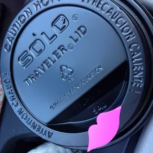 a close up of a coffee cup in a cup holder