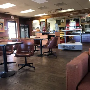 a boy sitting on a chair in a restaurant