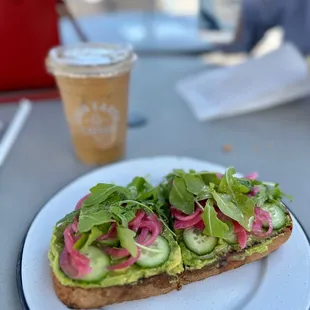 a sandwich with cucumbers and radishes