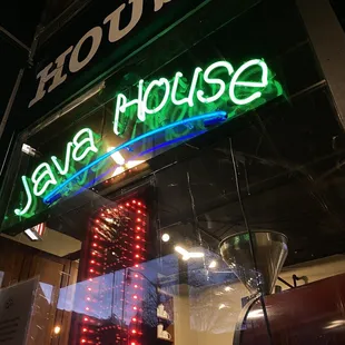 Restaurant name and open sign in neon lights