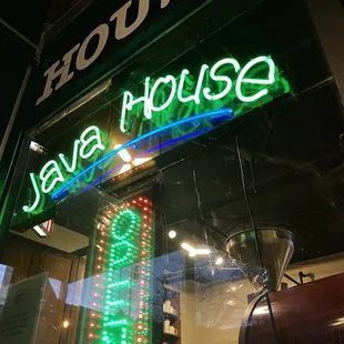 Restaurant name and open sign in neon lights