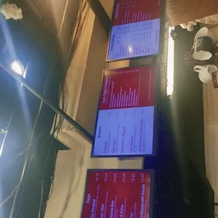 two computer monitors on a table