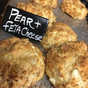 a tray of biscuits with a sign that says bert and feta cheese