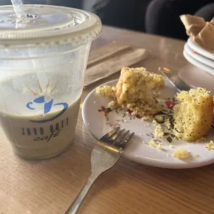 a plate of food and a cup of coffee