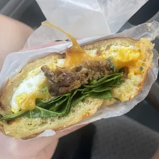 Breakfast croissant with egg, cheese, spinach and veggie sausage