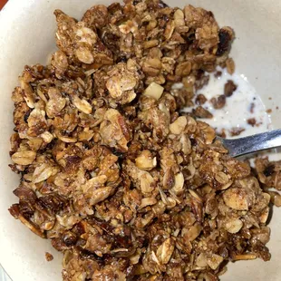 a bowl of granola and milk