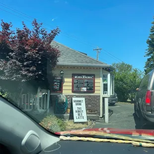 a car parked in front of a small business