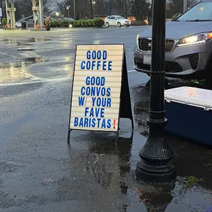 a good coffee sign on a rainy day