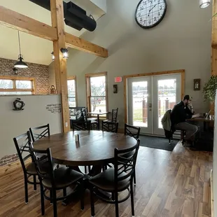 a dining room with a clock on the wall
