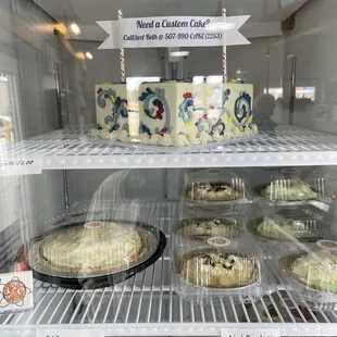a display of cakes and pies