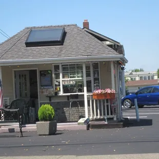 a small building with a solar panel on the roof