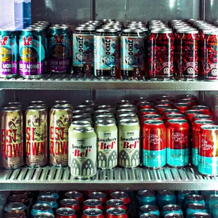 a refrigerator full of cans of soda