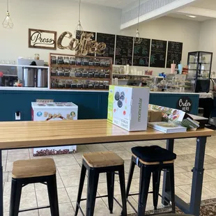 a coffee shop with tables and stools